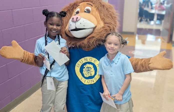  Students posing with Leo the Lion, Munger's mascot